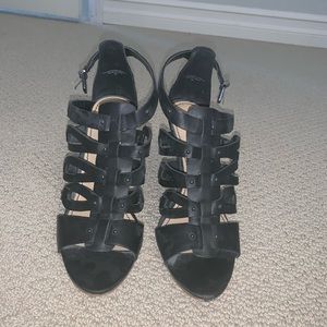 black gladiator-style heels